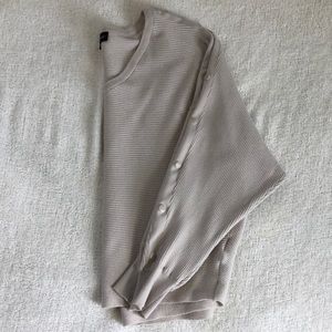 Light beige sweater w button details on side, worn once